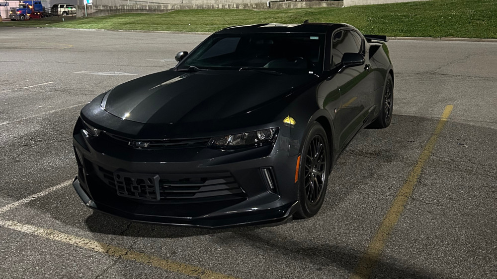 Sleek Black Camaro at Night wallpaper