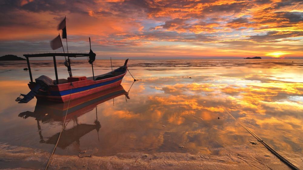 Golden Sunset Fishing Boat on Calm Lake wallpaper