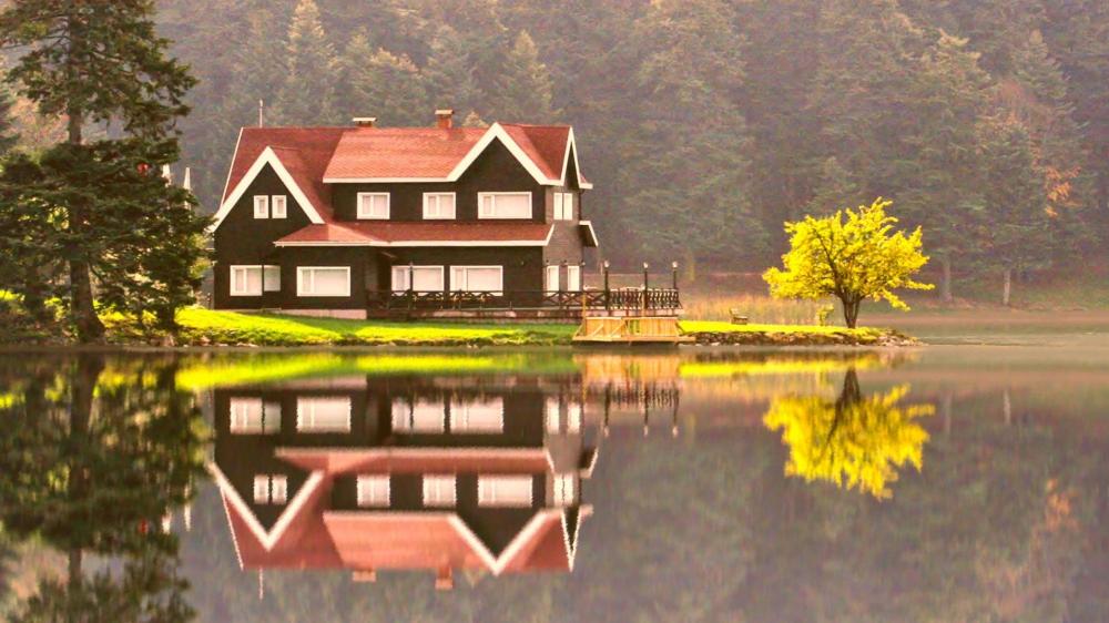 Tranquil Lakeside Cottage in Autumn Glory wallpaper