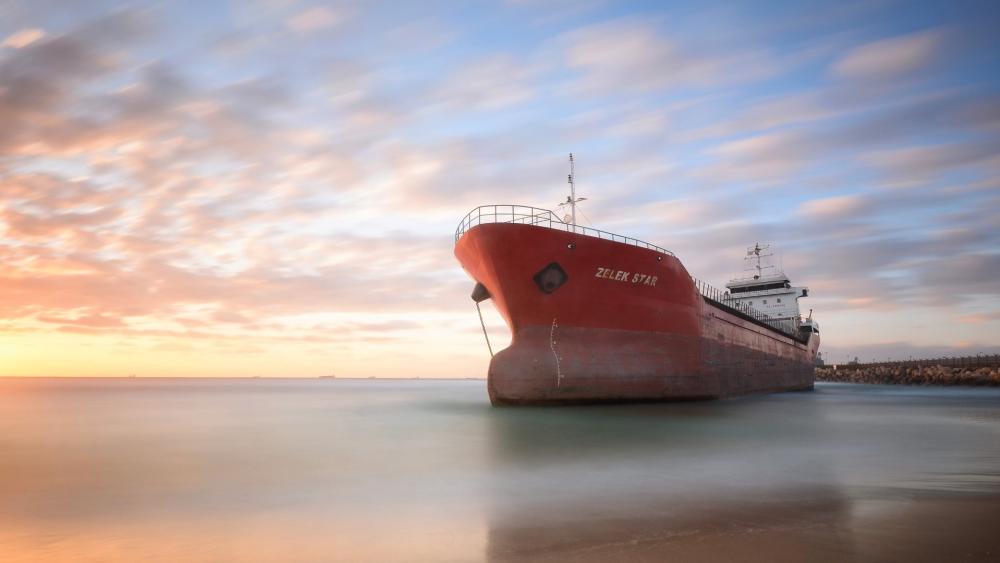 Cargo Ship at Sunset wallpaper