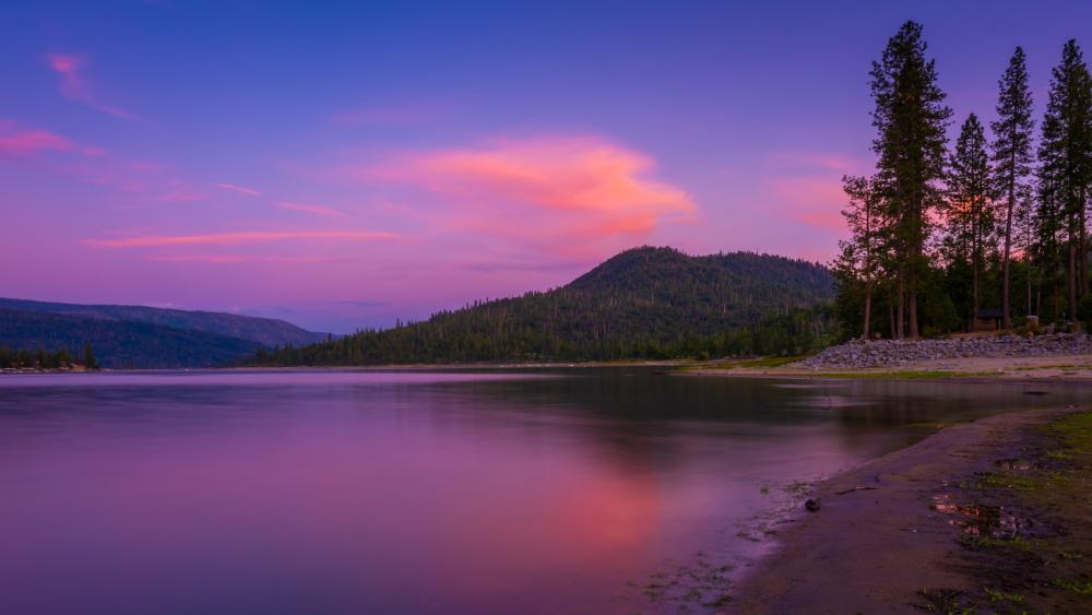 Serene Sunset Over Mountain Lake wallpaper