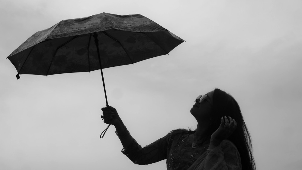 Silent Strength Under the Umbrella wallpaper