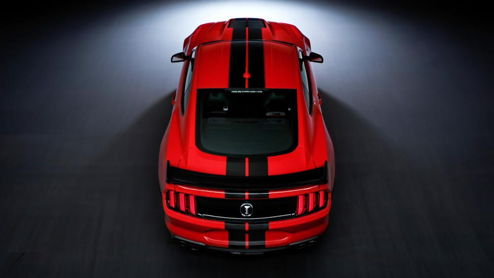 Red Shelby Mustang Under Dramatic Spotlight wallpaper