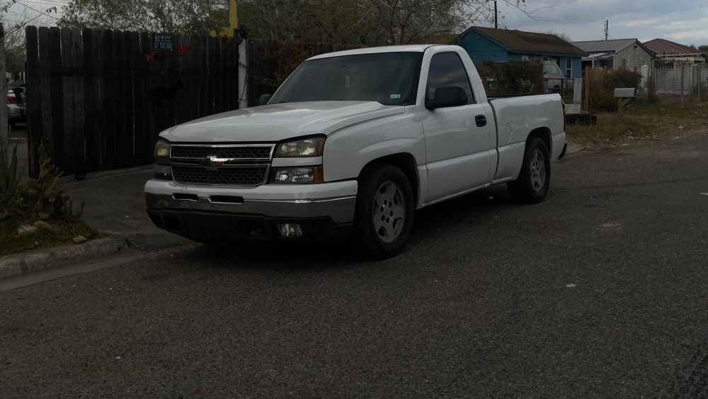 Classic White Pickup Truck on a Quiet Street wallpaper