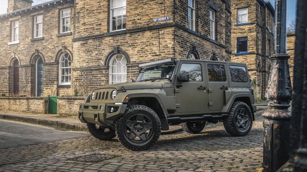 Matte Green Jeep Wrangler in Cobblestone Street wallpaper