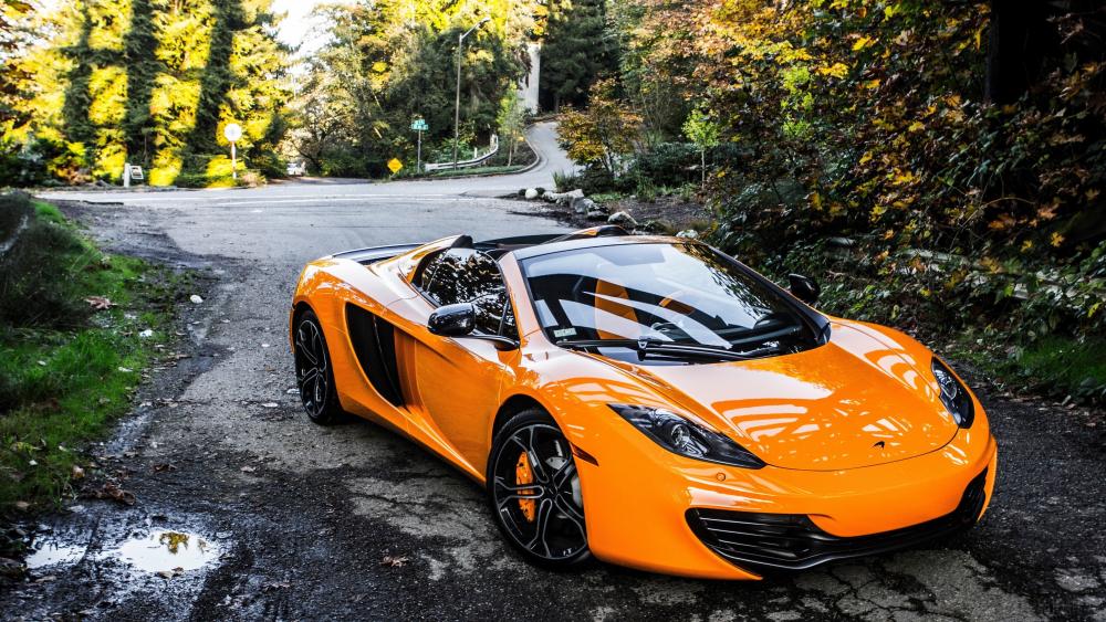 Orange McLaren on Forest Road wallpaper
