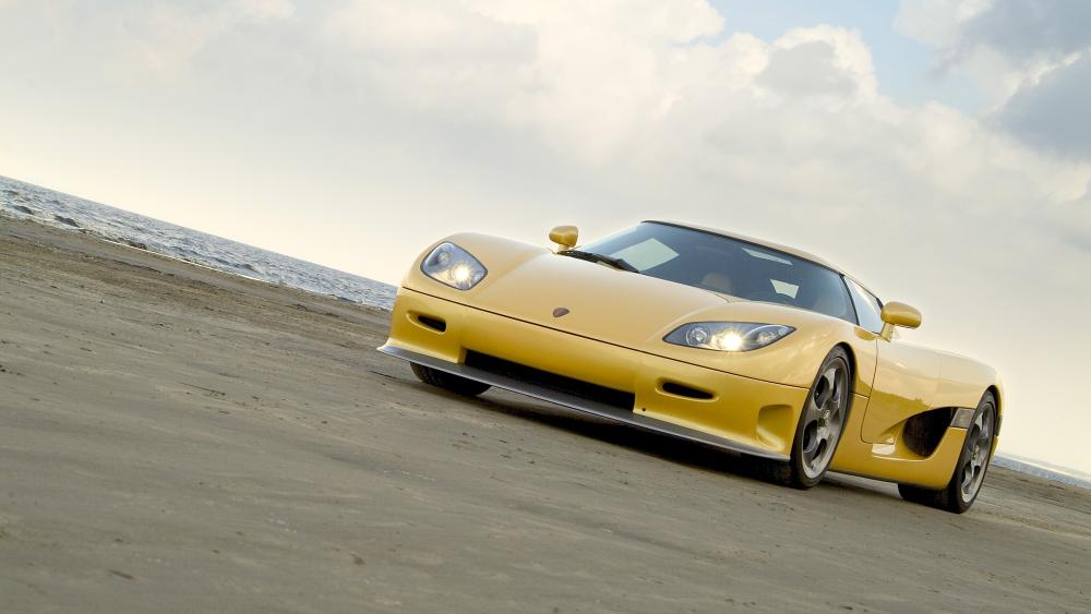 Yellow Porsche Carrera GT on the Shoreline wallpaper