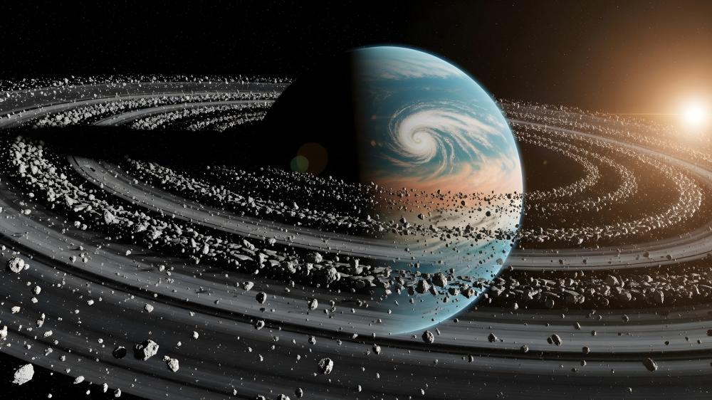 Ringed Planet Amidst Cosmic Debris wallpaper