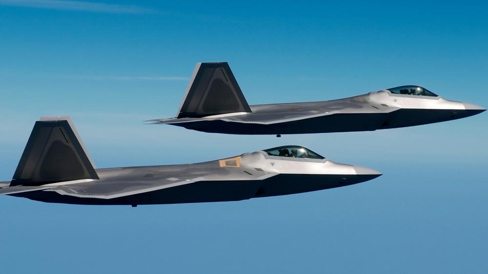 Lockheed Martin F-22 Raptors in Flight wallpaper