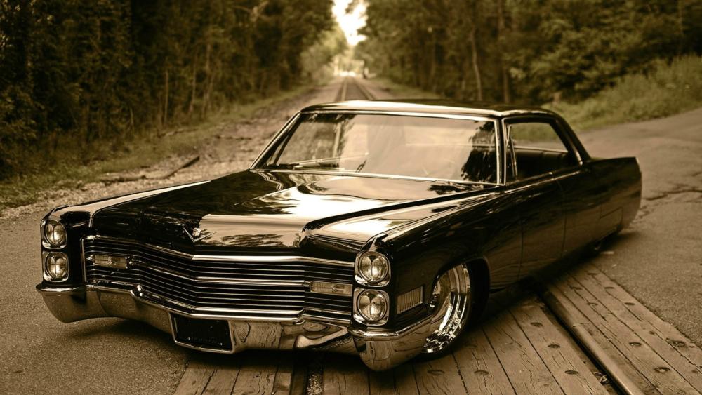 Sleek Slammed Cadillac Eldorado on a Quiet Road wallpaper