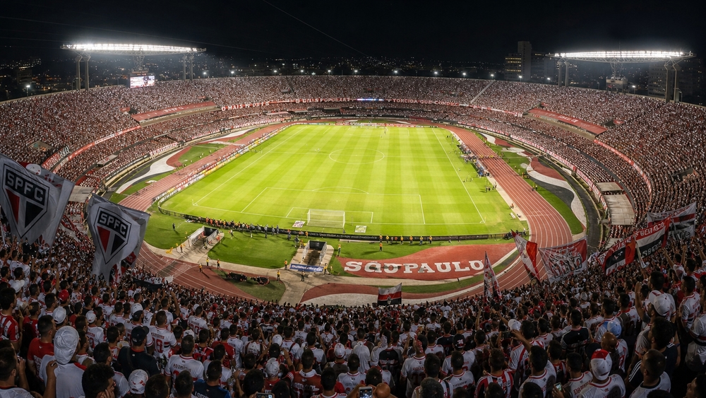 Electric Night Match in a Packed Soccer Stadium wallpaper