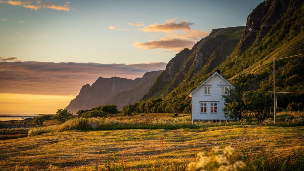 Golden Cottage Beneath Andøya Cliffs wallpaper