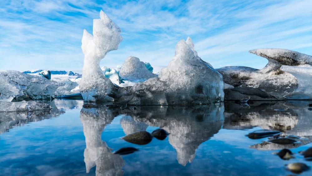 Jokulsarlon Ice Sculptures Over Mirror Water wallpaper
