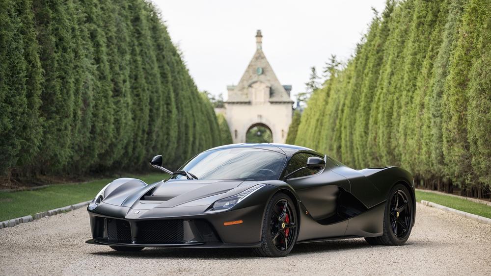 Matte Black Ferrari LaFerrari on Elegant Driveway wallpaper