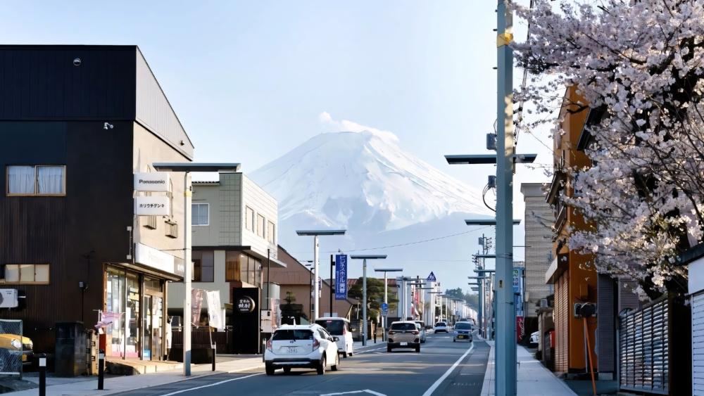 Fujiyoshida Street View with Mount Fuji and Cherry Blossoms wallpaper