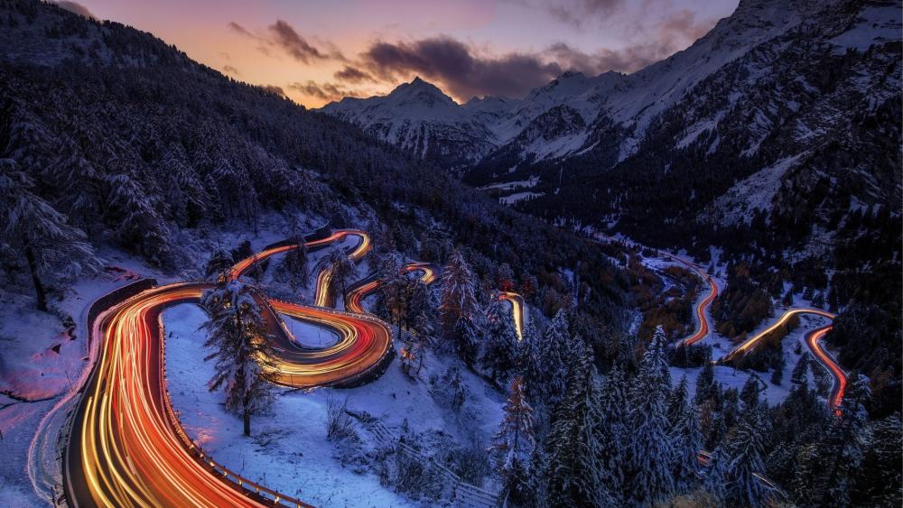 Twilight Light Trails Through the Swiss Alpine Pass wallpaper