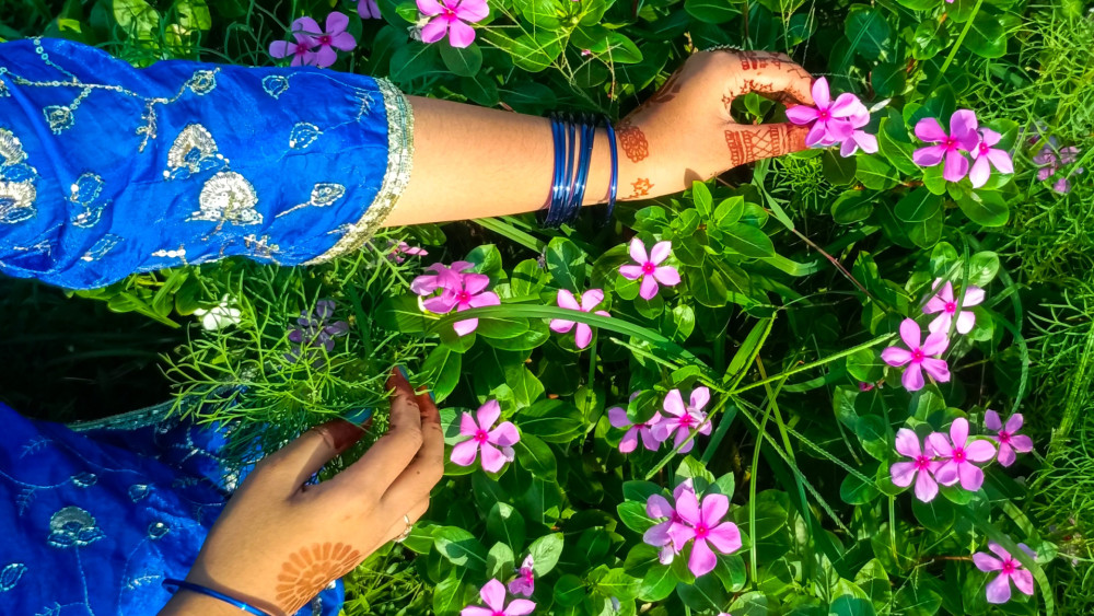 Pink Wildflowers with Henna Adorned Hands wallpaper