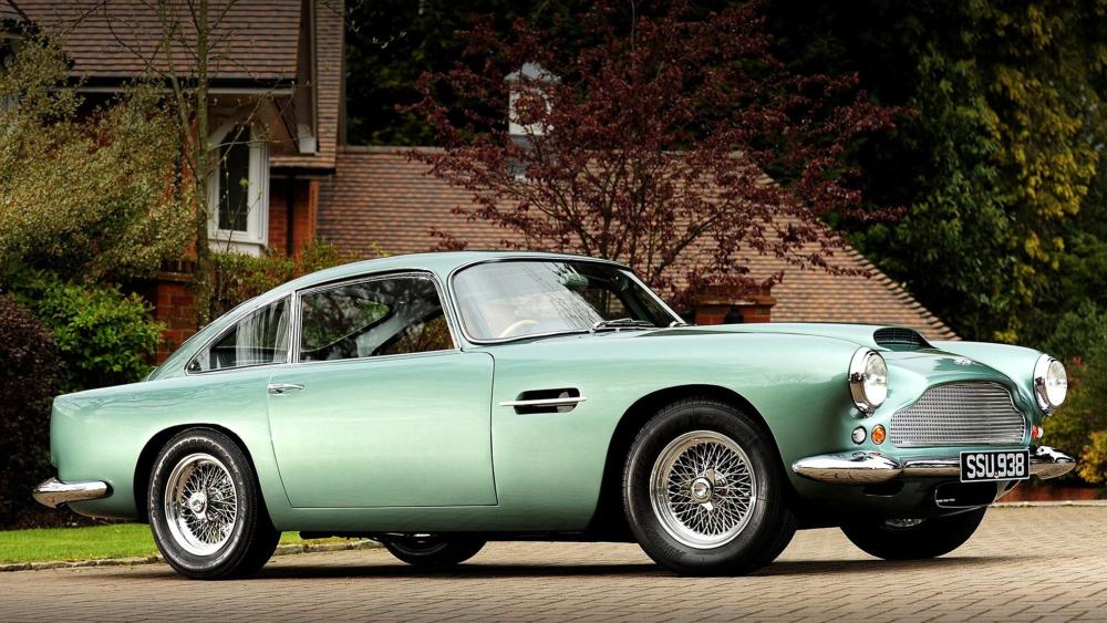 Elegant Aston Martin DB4 in Mint Green wallpaper