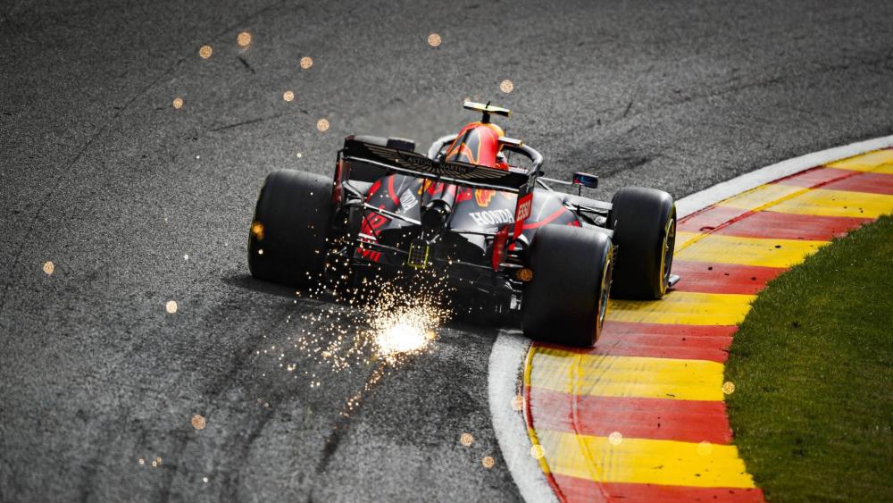 Blazing Formula One Cornering Action wallpaper
