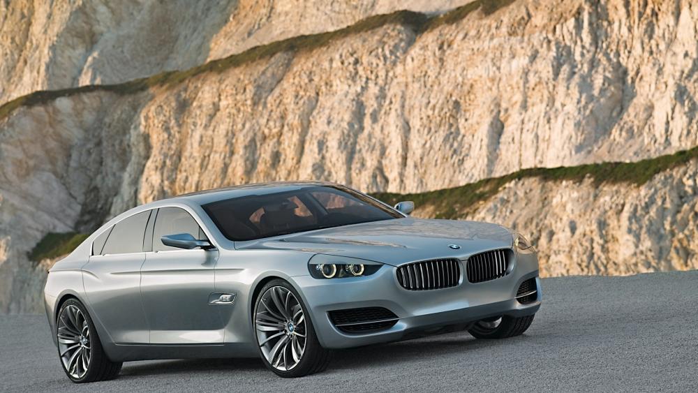 Elegant BMW Sedan on Scenic Mountain Road wallpaper