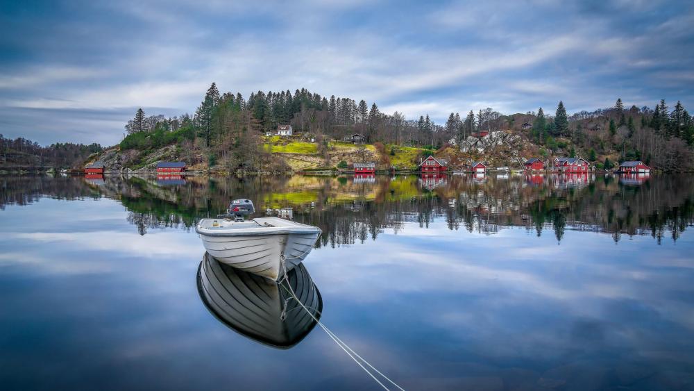 Serene Boat Reflection in Norwegian Fjord Village wallpaper
