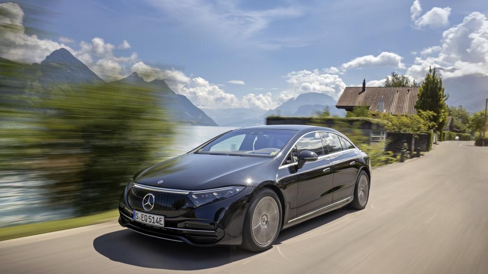 Sleek Mercedes-Benz EQS Cruising Lakeside Road wallpaper