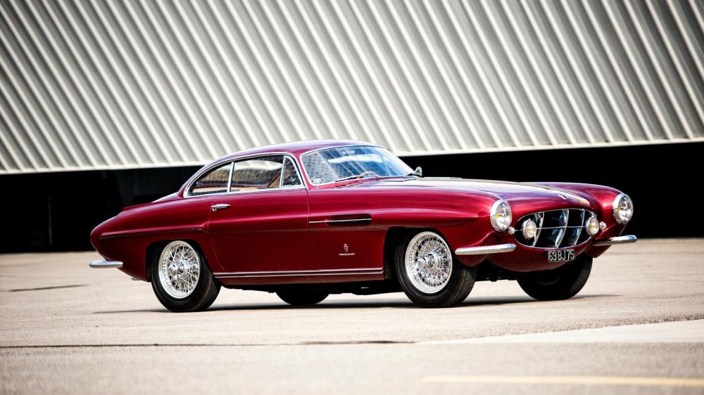Classic Jaguar XK120 in Elegant Motion wallpaper