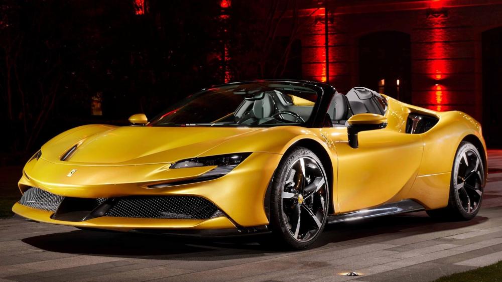 Golden Ferrari SF90 Spider at Night wallpaper