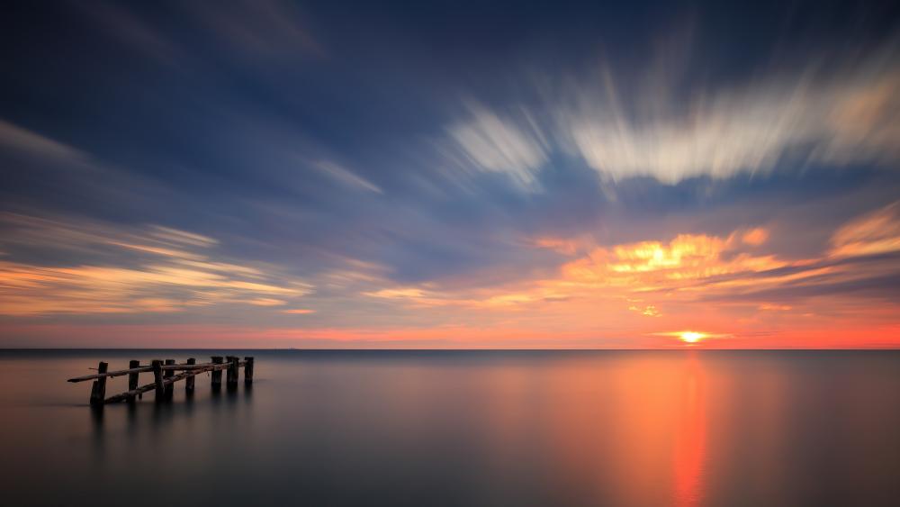 Serene Sunset Over Tranquil Seascape wallpaper