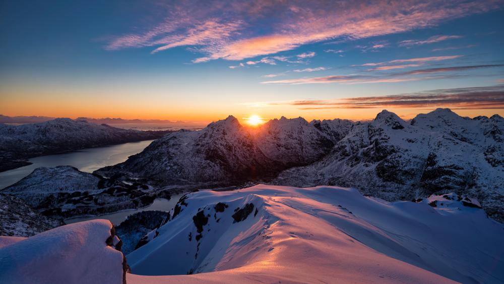 Alpine Sunrise Over Snowy Peaks wallpaper