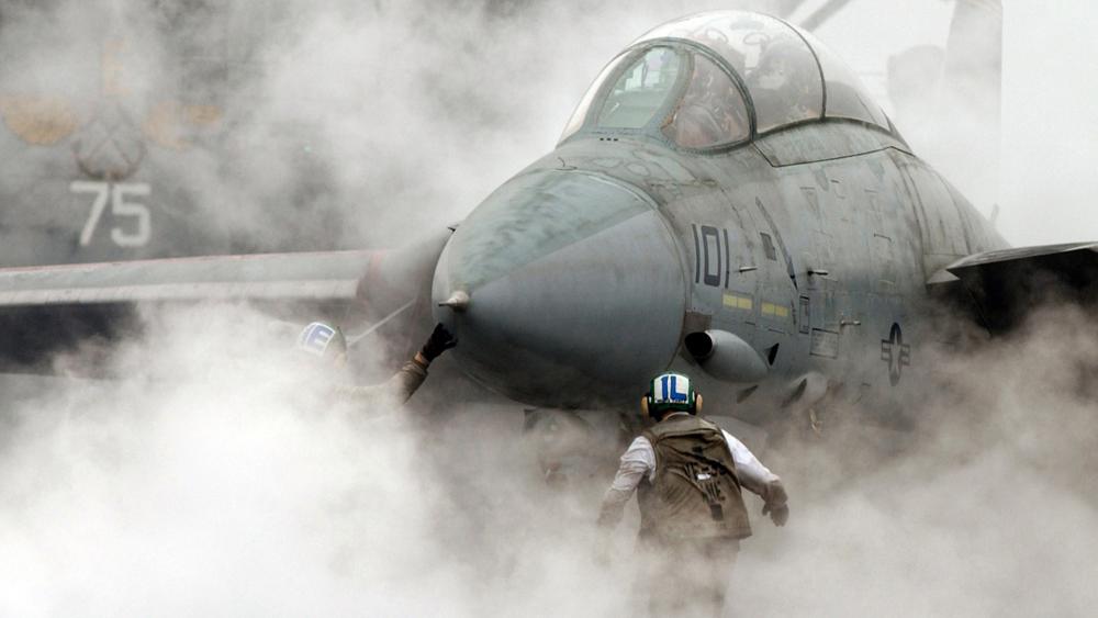 Fighter Jet in Smoke Filled Hangar wallpaper