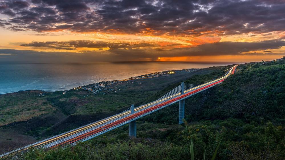 Sunset Highway Over Coastal Bridge wallpaper
