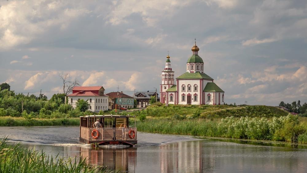 Peaceful River Journey by Suzdal Church wallpaper