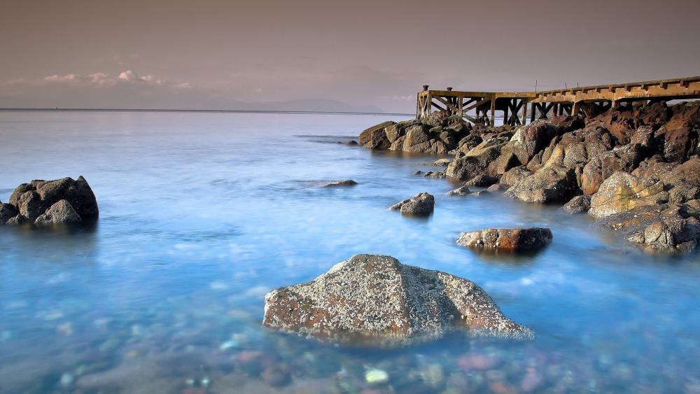 Tranquil Coastal Waters at Sunset wallpaper