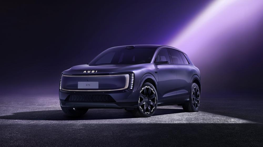 Audi E7X Electric SUV Under Purple Spotlight wallpaper