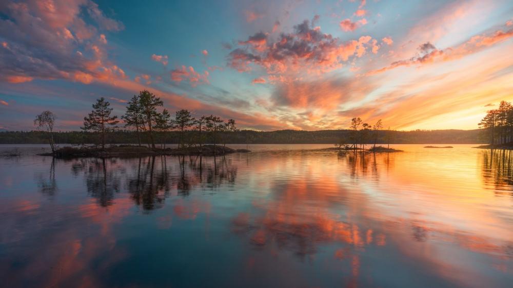Sunset Glow Over Calm Lake Islets wallpaper