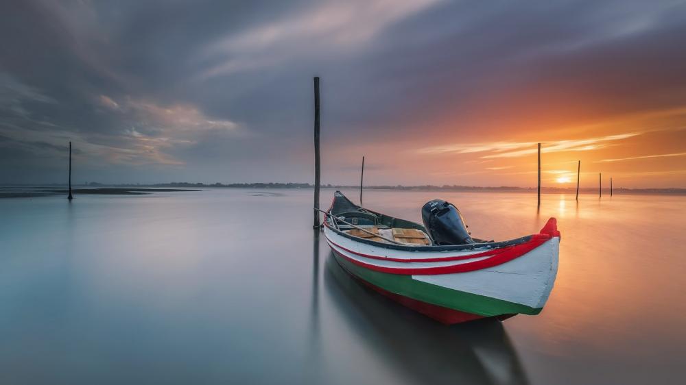 Sunset Boat on Tranquil Lake wallpaper