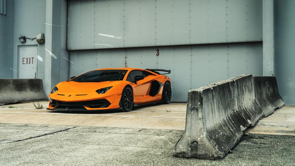 Orange Lamborghini Aventador SVJ Industrial Pose wallpaper