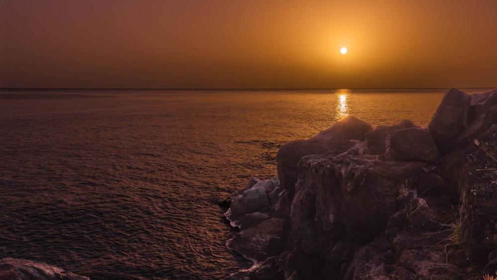 Golden Sunset Over Quiet Cliffs wallpaper
