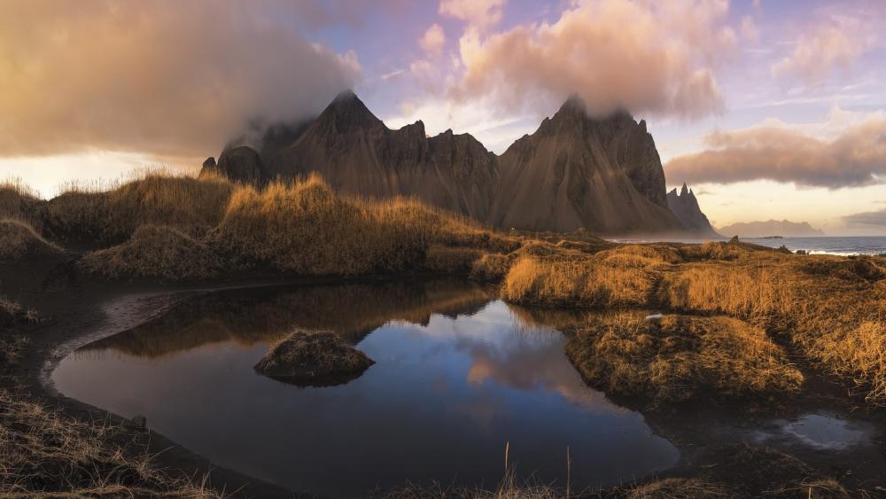 Majestic Peaks at Stokksnes in Golden Hour Light wallpaper