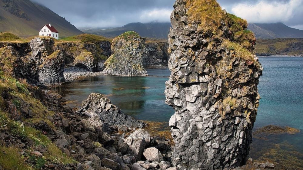 Cliffside Village and Sea Stacks in Iceland wallpaper