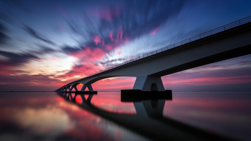 Zeelandbrug Sunset Over Tranquil Waters wallpaper
