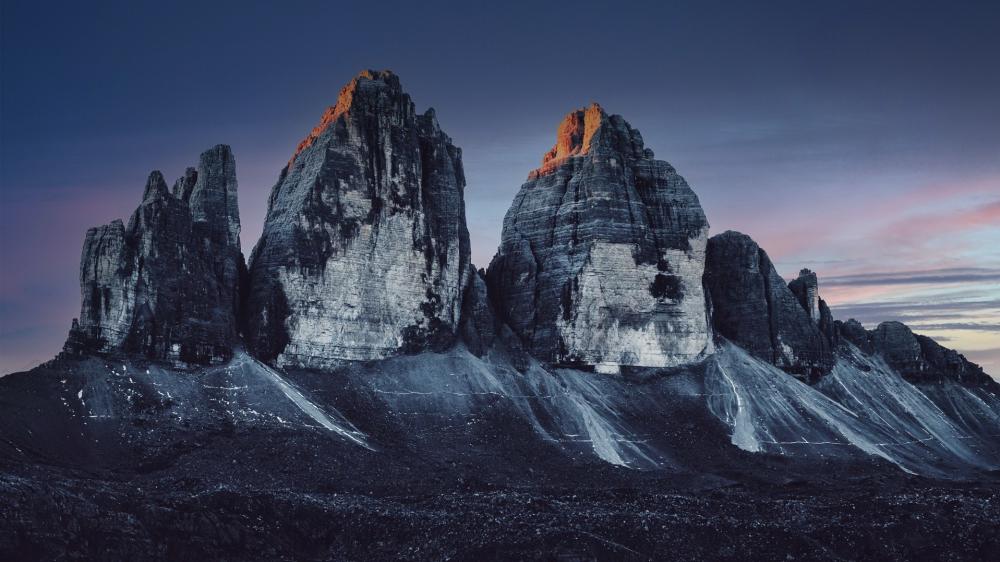 Twilight Glow Over Tre Cime Peaks wallpaper