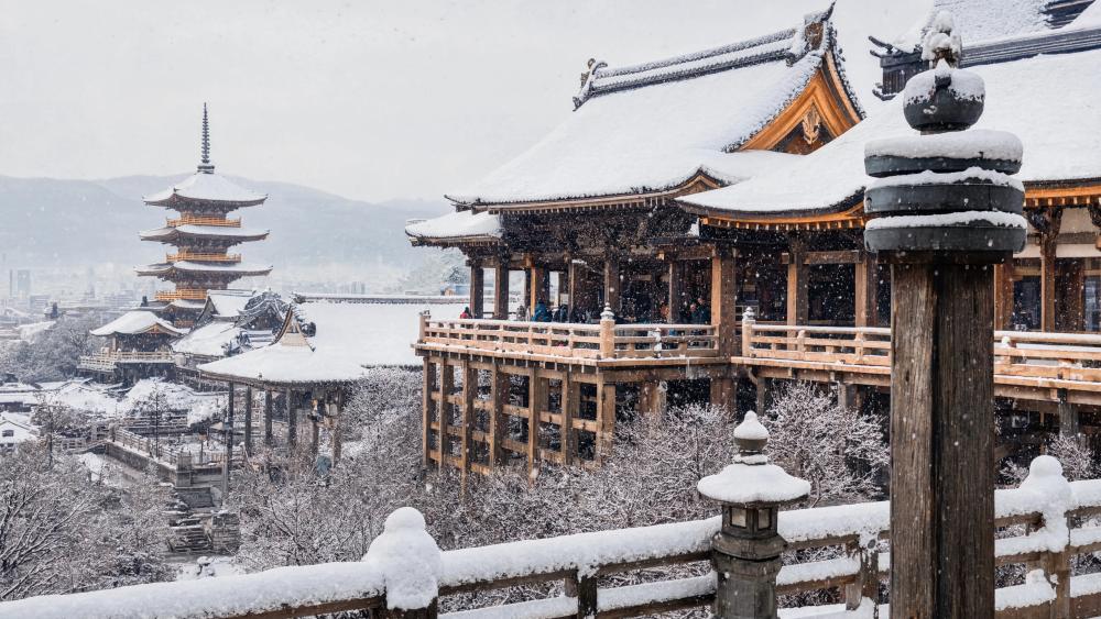Snowy Temple Serenity Over Ancient City wallpaper