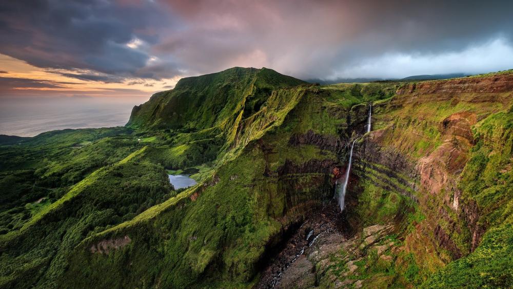 Verdant Cliffs and Cascading Waters of Flores Island wallpaper