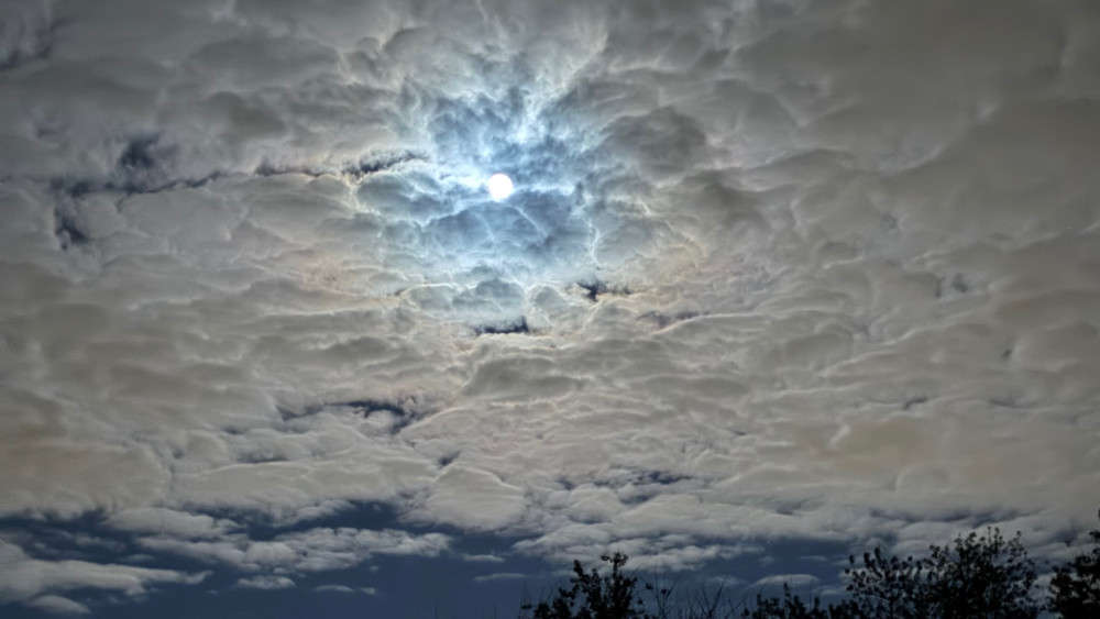 Moonlit Cloudscape Over Silent Night Sky wallpaper