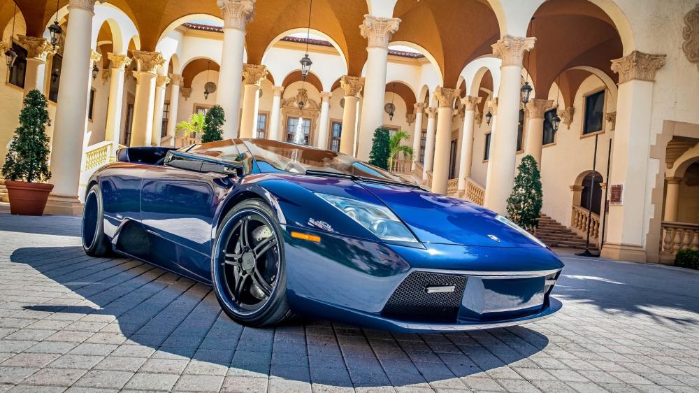 Blue Lamborghini Murcielago Roadster in Elegant Courtyard wallpaper