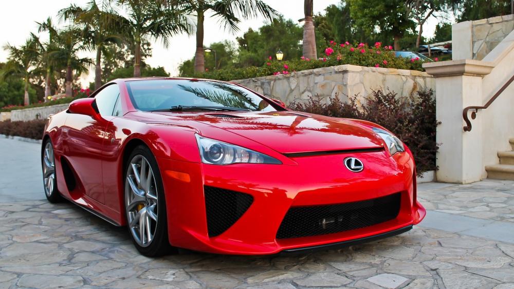 Red Lexus Sports Car in Tropical Driveway wallpaper