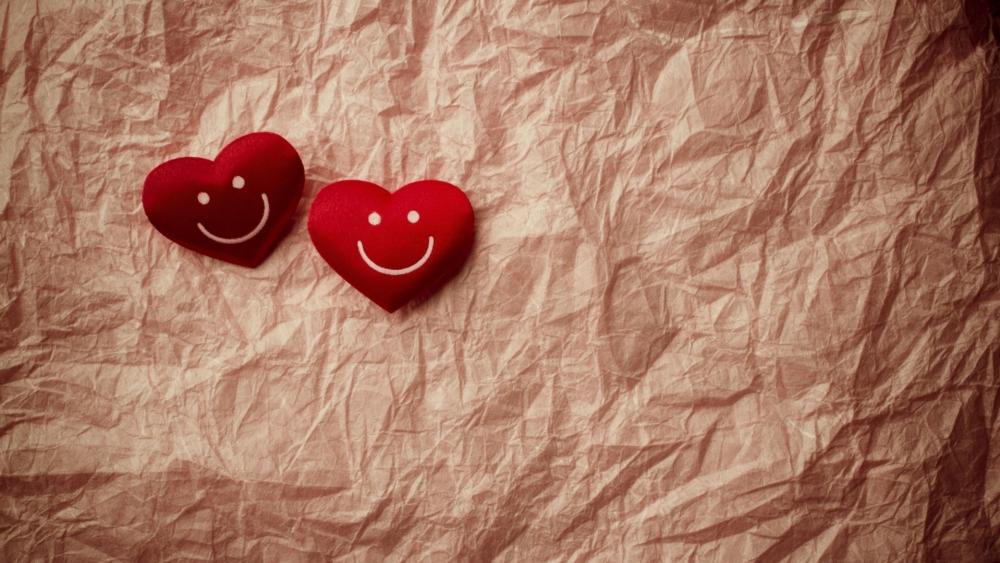 Smiling Hearts on Soft Romantic Background wallpaper