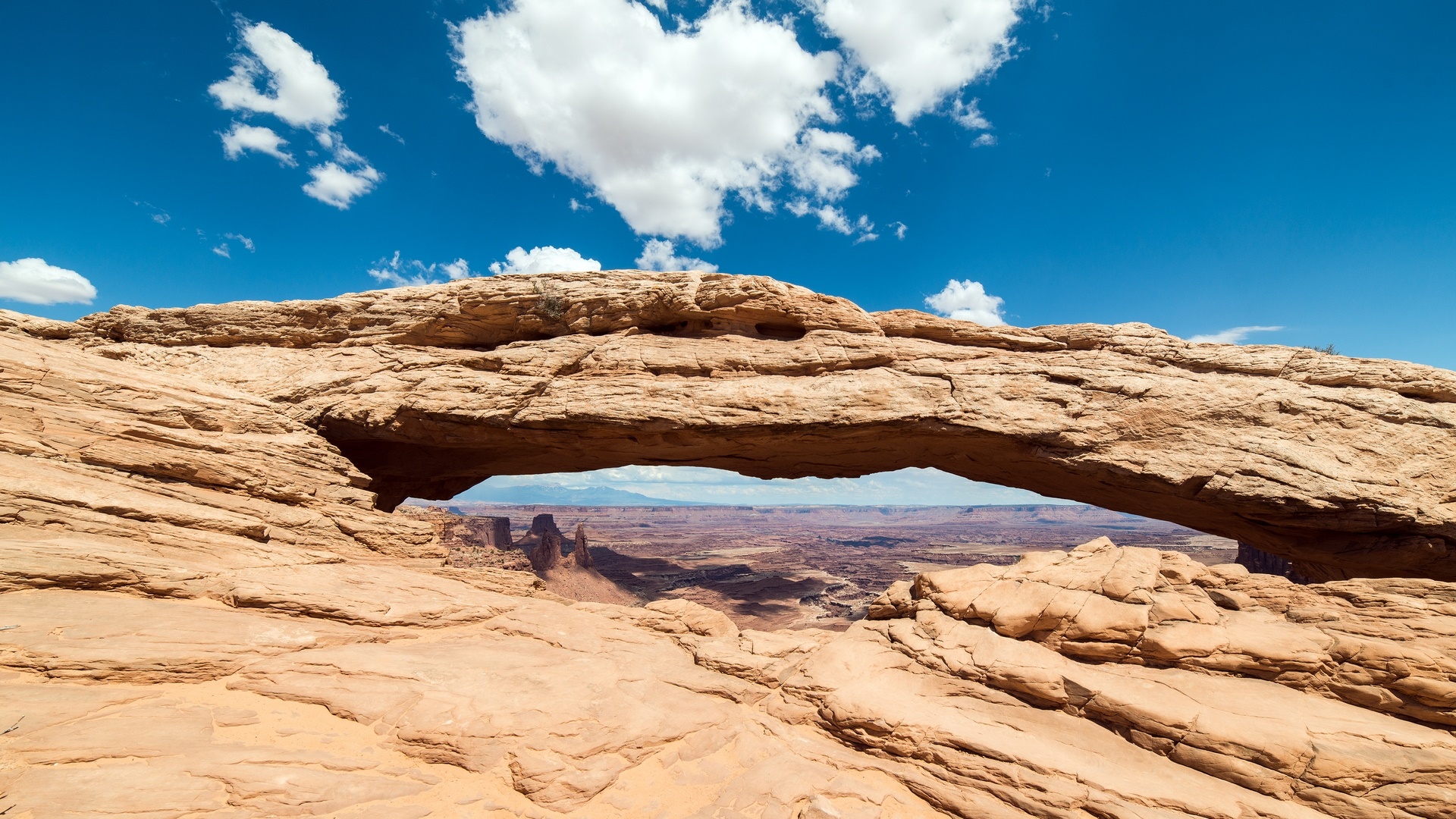Majestic Natural Arch Under a Vibrant Sky - backiee